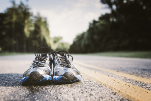 Lone pair of new running shoes, just waiting to be used on an open road